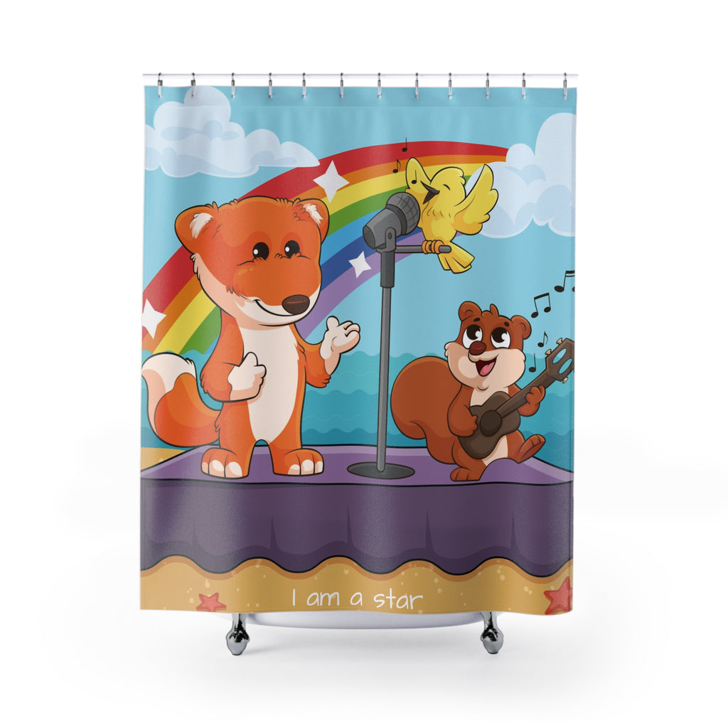 A shower curtain hanging from a rod in front of a stand-alone tub. The shower curtain has a scene of a fox singing with a bird and squirrel on a stage on the beach with a rainbow in the background and the phrase "I am a star" along the bottom.