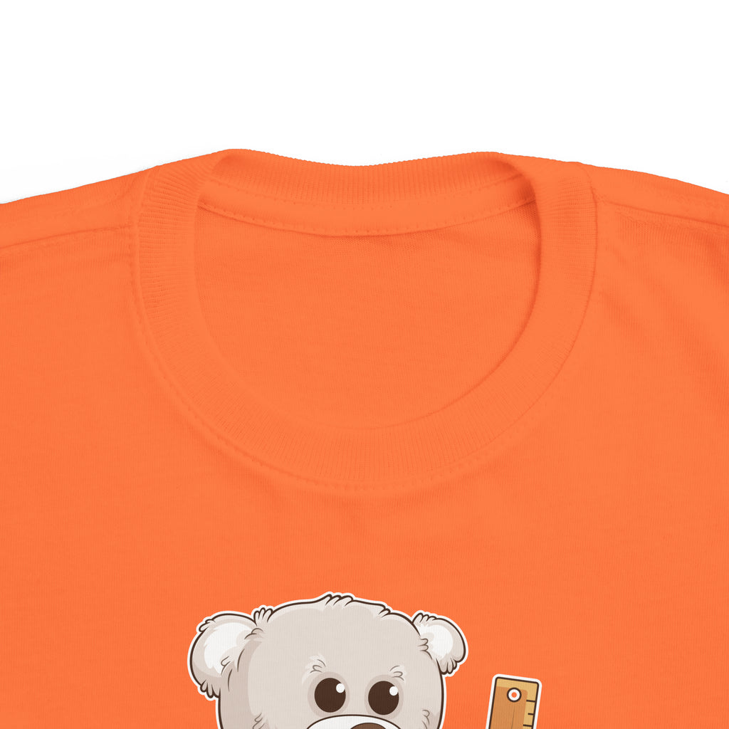 A close-up of the crew neckline of a short-sleeve orange shirt with a picture of a bear that says I am responsible.