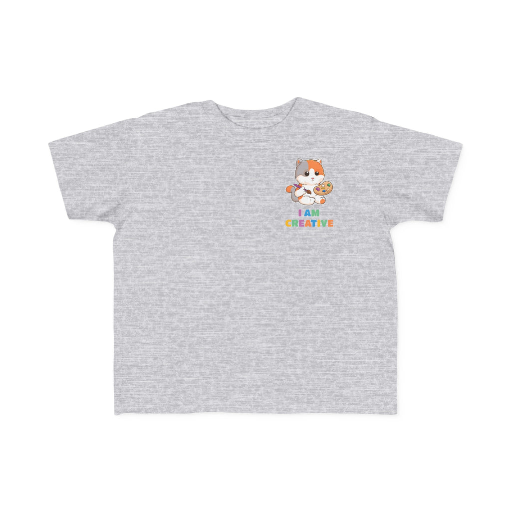A short-sleeve heather grey shirt with a small picture on the left chest. The image is a cat with a multi-color phrase below it that says I am creative.