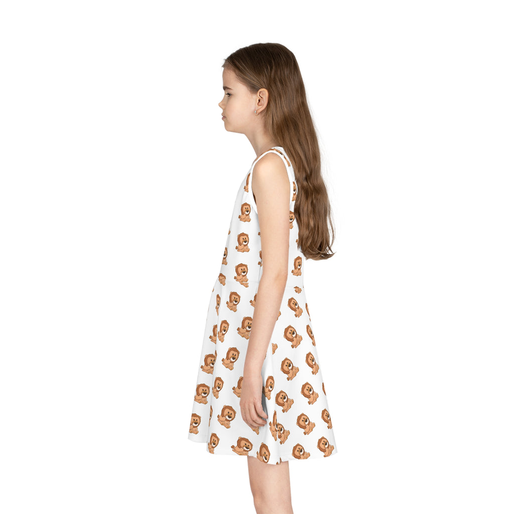 Left side-view of a girl wearing a sleeveless white dress with a repeating pattern of a lion.