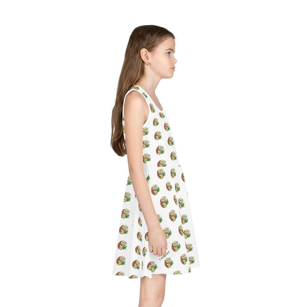 Right side-view of a girl wearing a sleeveless white dress with a repeating pattern of a turtle.