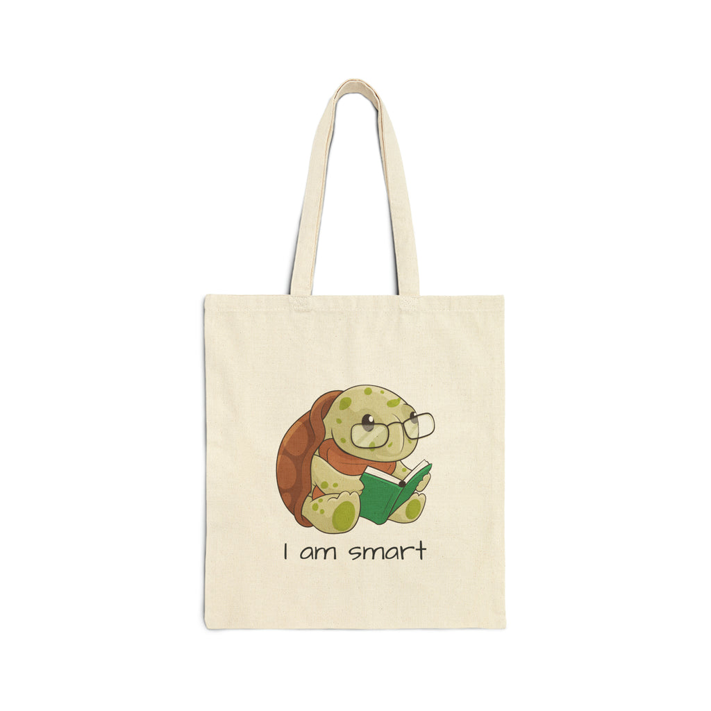 A natural tan tote bag with a picture of a turtle that says I am smart.