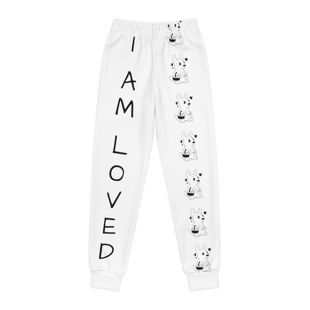 White sweatpants with a line of black and white kangaroos down the front left leg and the phrase "I am loved" down the front right leg.