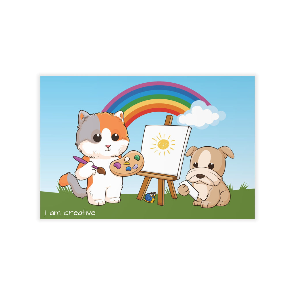 A wall decal that has a scene of a cat painting on a canvas next to a dog, a rainbow in the background, and the phrase "I am creative" along the bottom.