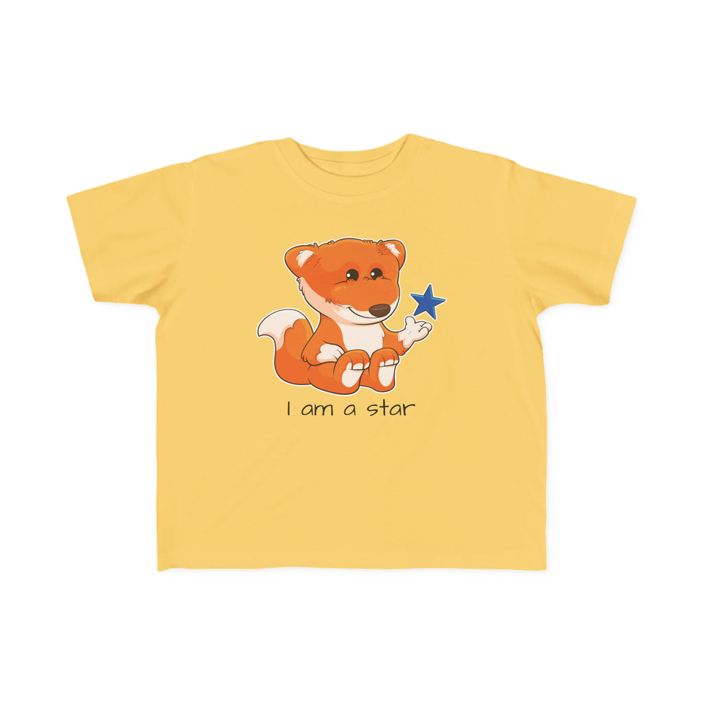 A short-sleeve yellow shirt with a picture of a fox that says I am a star.
