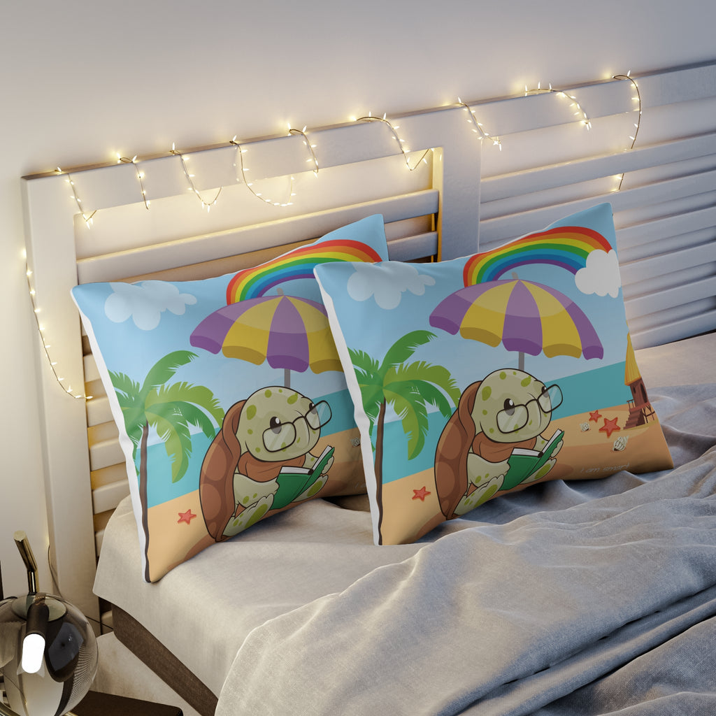 Two pillows sitting on a bed. The pillows have on pillowcases with a scene of a turtle reading a book under an umbrella on the beach, a rainbow in the background, and the phrase "I am smart" along the bottom.