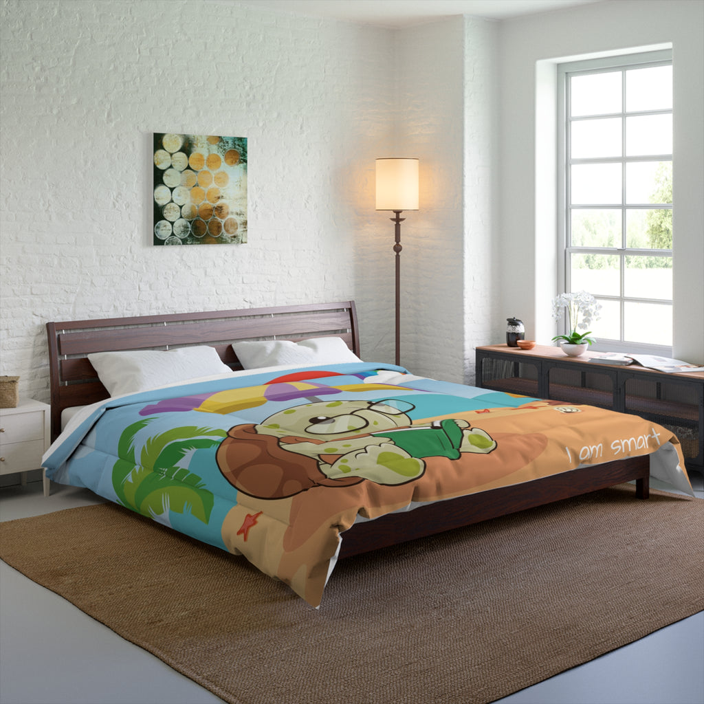 A 104 by 88 inch bed comforter with a scene of a turtle reading a book under an umbrella on a beach, a rainbow in the background, and the phrase "I am smart" along the bottom. The comforter covers a queen-sized bed.