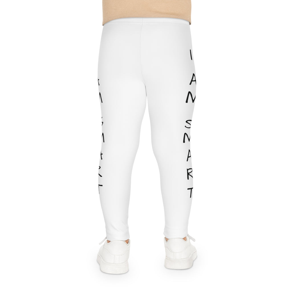 Back-view of a child wearing white leggings with the phrase "I am smart" read top to bottom on the side of each leg.