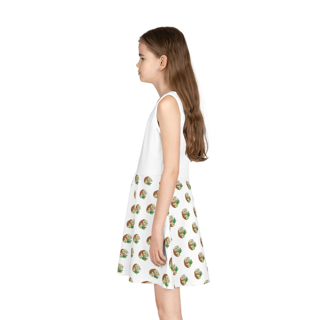 Left side-view of a girl wearing a sleeveless white dress with a white top and a repeating pattern of a turtle on the skirt.