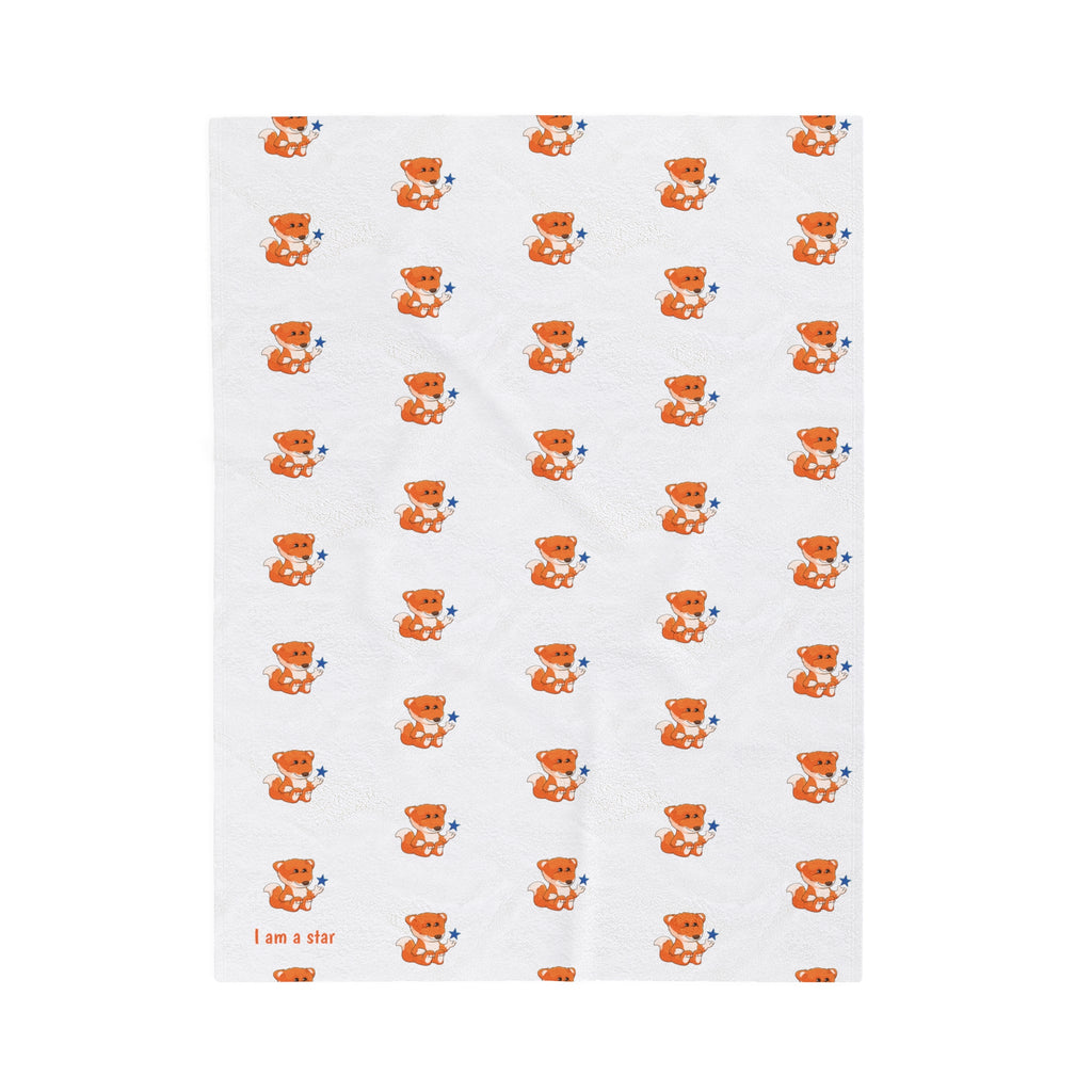 A blanket that has a repeating pattern of a fox and the phrase “I am a star” in the bottom left corner.