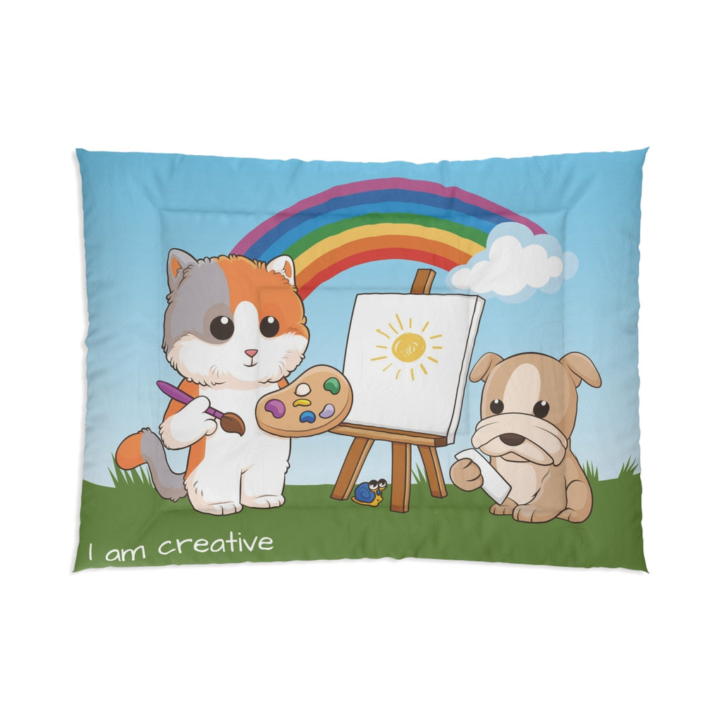 A 68 by 92 inch bed comforter with a scene of a cat painting on a canvas next to a dog, a rainbow in the background, and the phrase "I am creative" along the bottom.