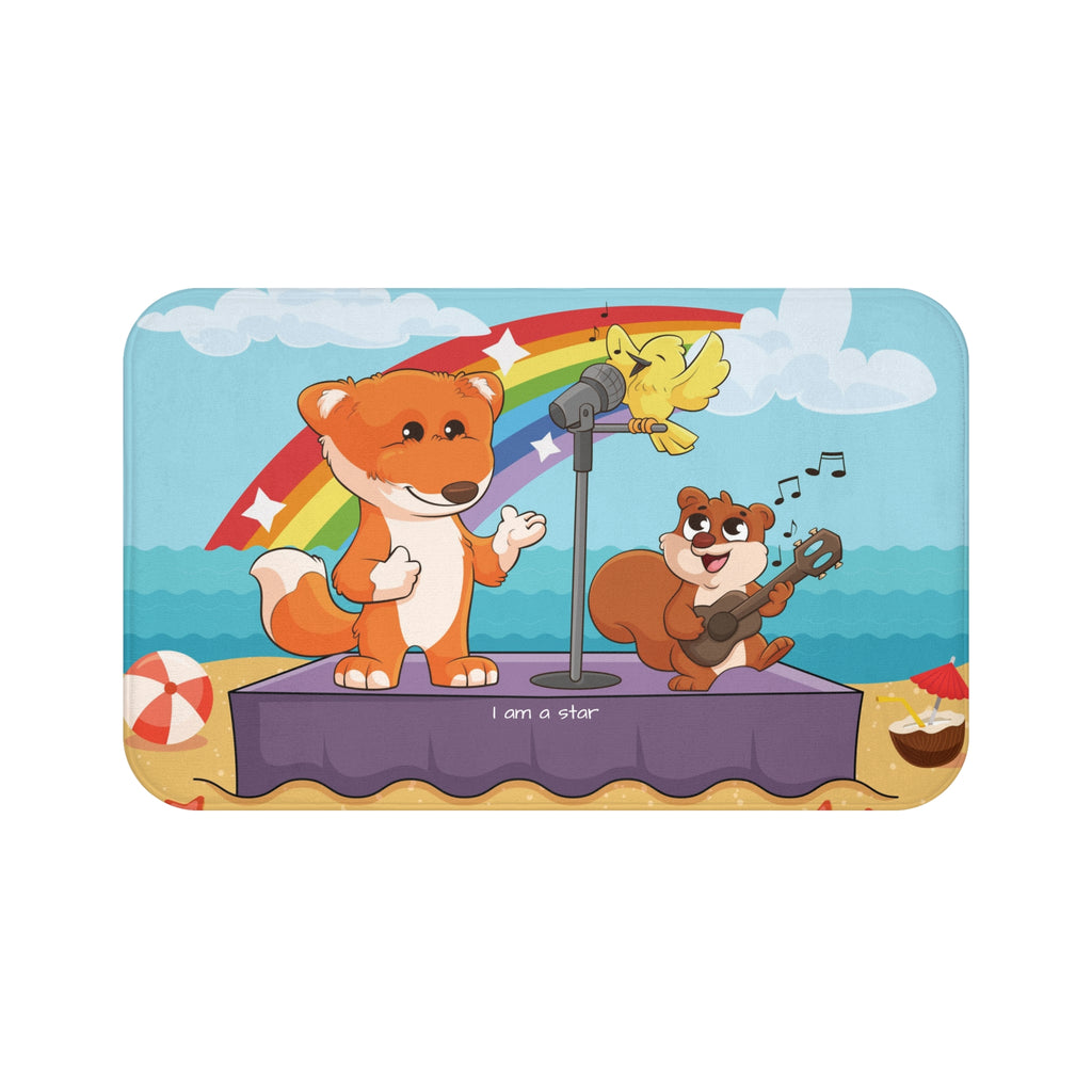 A 34 by 21 inch bath mat that has a scene of a fox singing with a bird and squirrel on a stage on the beach with a rainbow in the background and the phrase "I am a star" along the bottom.