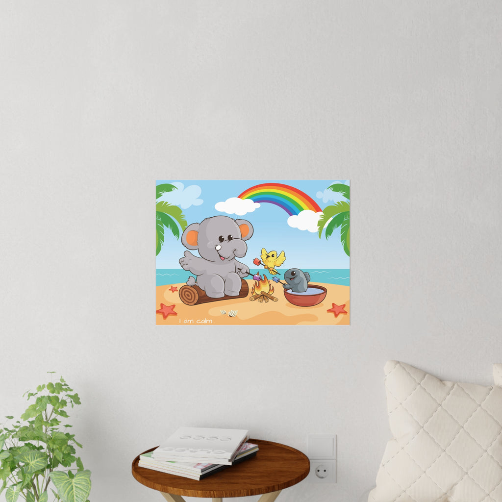 A 24 by 18 inch wall decal on a grey wall above a table and couch. The wall decal has a scene of an elephant having a bonfire with a bird and fish on the beach, a rainbow in the background, and the phrase "I am calm" along the bottom.