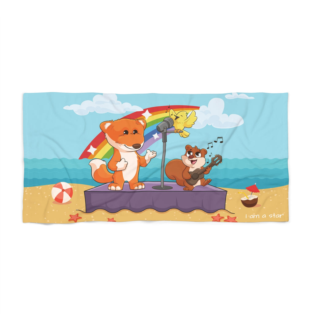 A 36 by 72 inch beach towel with a scene of a fox singing with a bird and squirrel on a stage on the beach, a rainbow in the background, and the phrase "I am a star" along the bottom.