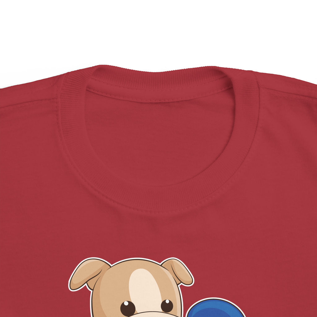 A close-up of the crew neckline of a short-sleeve garnet red shirt with a picture of a dog that says I am loyal.