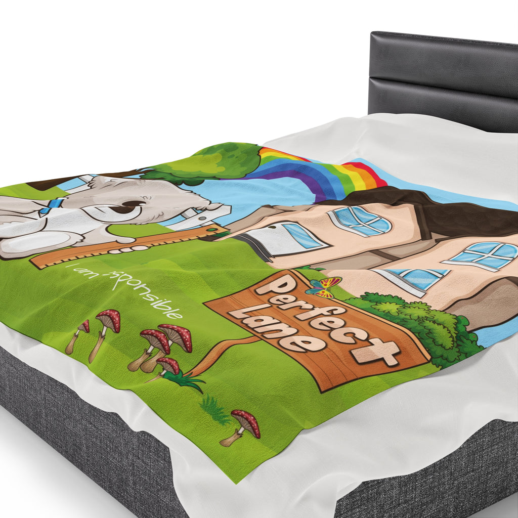 Side-view of a 60 by 80 inch blanket on a queen-sized bed. The blanket has a scene of a bear sitting in the yard of its house with a rainbow in the background and the phrase "I am responsible" along the bottom.