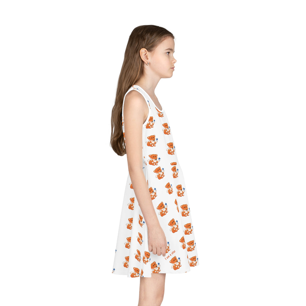 Right side-view of a girl wearing a sleeveless white dress with a repeating pattern of a fox.