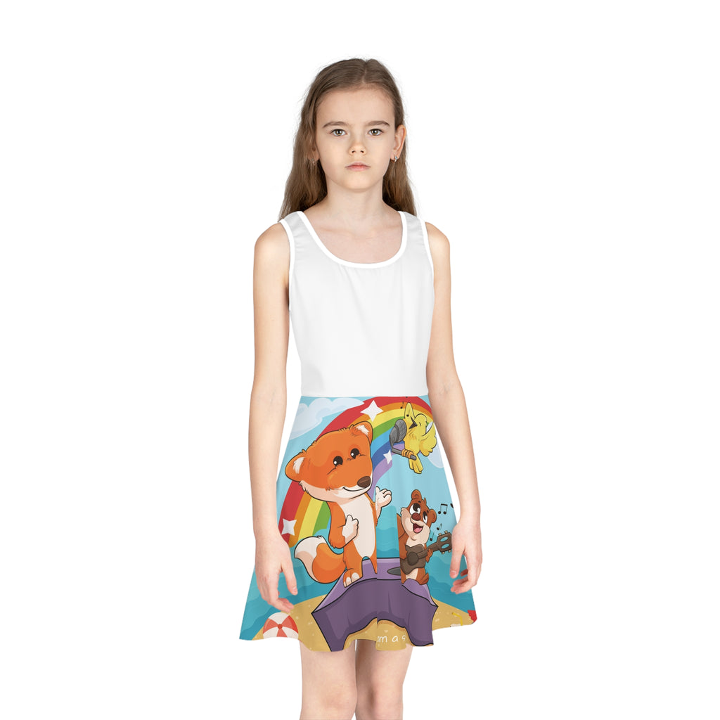 Front-view of a girl wearing a sleeveless dress. The dress has a white top and the skirt features a scene of a fox singing with a bird and squirrel on a stage on the beach and the phrase "I am a star" along the bottom.