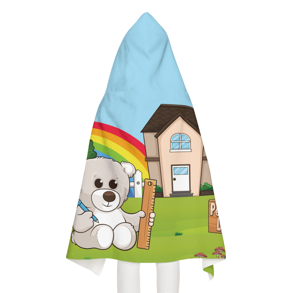 Back-view of a girl wearing a hooded towel. The towel has a scene of a bear sitting in the yard of its house, a rainbow in the background, and the phrase "I am responsible" along the bottom.