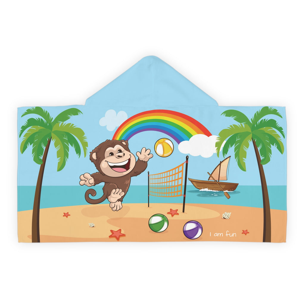 Back-view of a hooded towel with a scene of a monkey playing volleyball on the beach, a rainbow in the background, and the phrase "I am fun" along the bottom.
