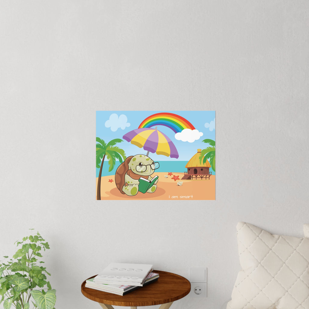 A 24 by 18 inch wall decal on a grey wall above a table and couch. The wall decal has a scene of a turtle reading a book under an umbrella on the beach, a rainbow in the background, and the phrase "I am smart" along the bottom.