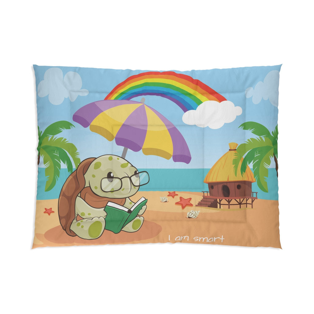A 68 by 92 inch bed comforter with a scene of a turtle reading a book under an umbrella on a beach, a rainbow in the background, and the phrase "I am smart" along the bottom.
