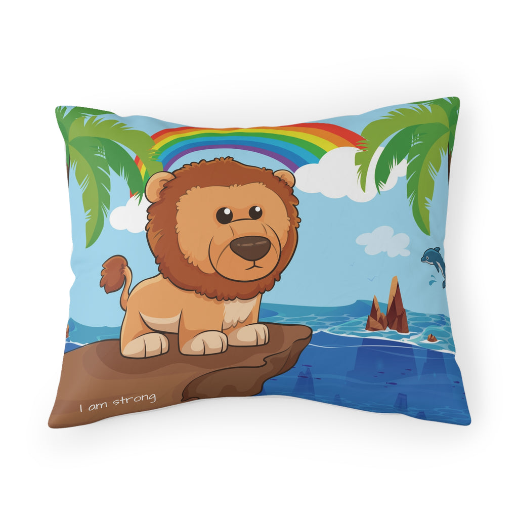 A pillowcase with a scene of a lion standing on a cliff over the ocean, a rainbow in the background, and the phrase "I am strong" along the bottom.