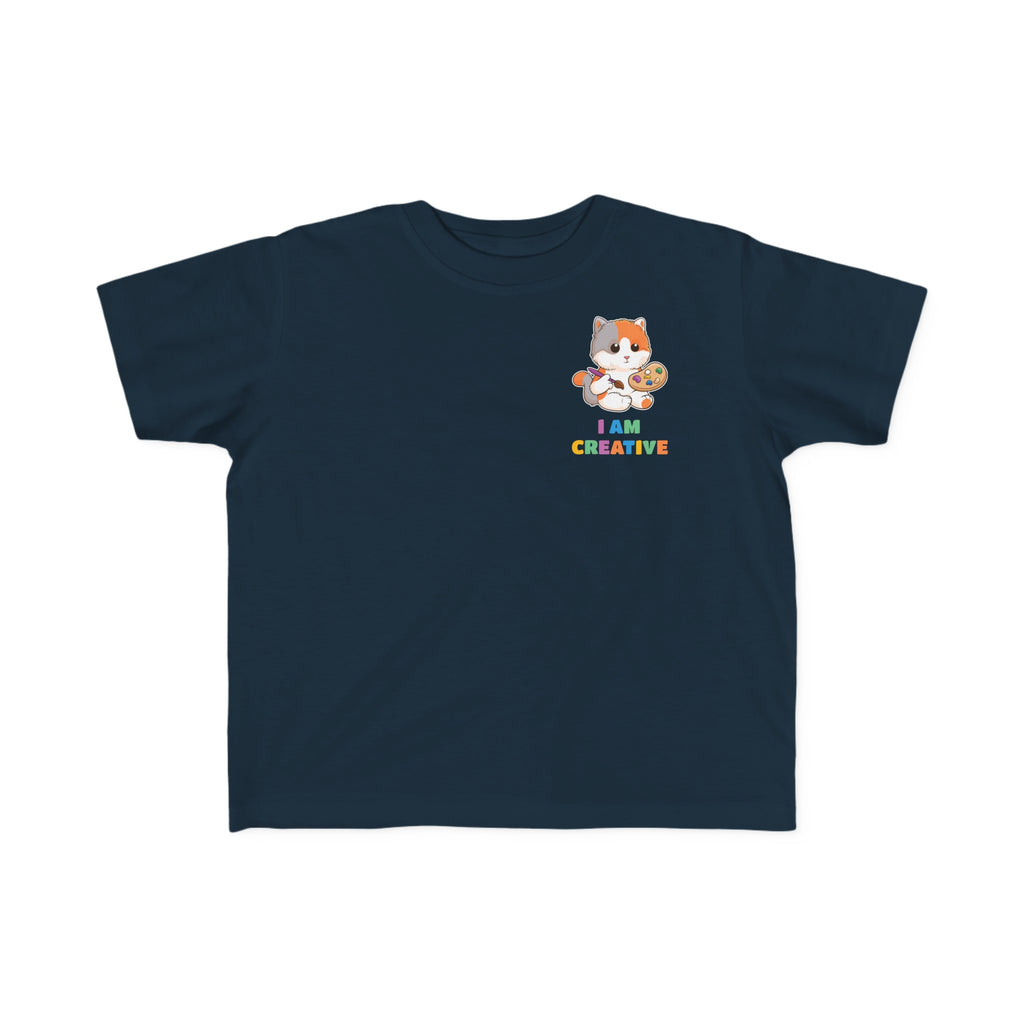 A short-sleeve navy blue shirt with a small picture on the left chest. The image is a cat with a multi-color phrase below it that says I am creative.