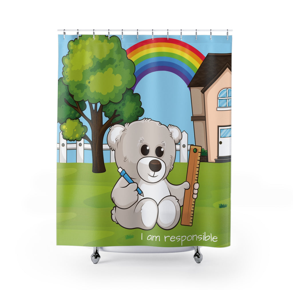 A shower curtain hanging from a rod in front of a stand-alone tub. The shower curtain has a scene of a bear sitting in the yard of its house with a rainbow in the background and the phrase "I am responsible" along the bottom.
