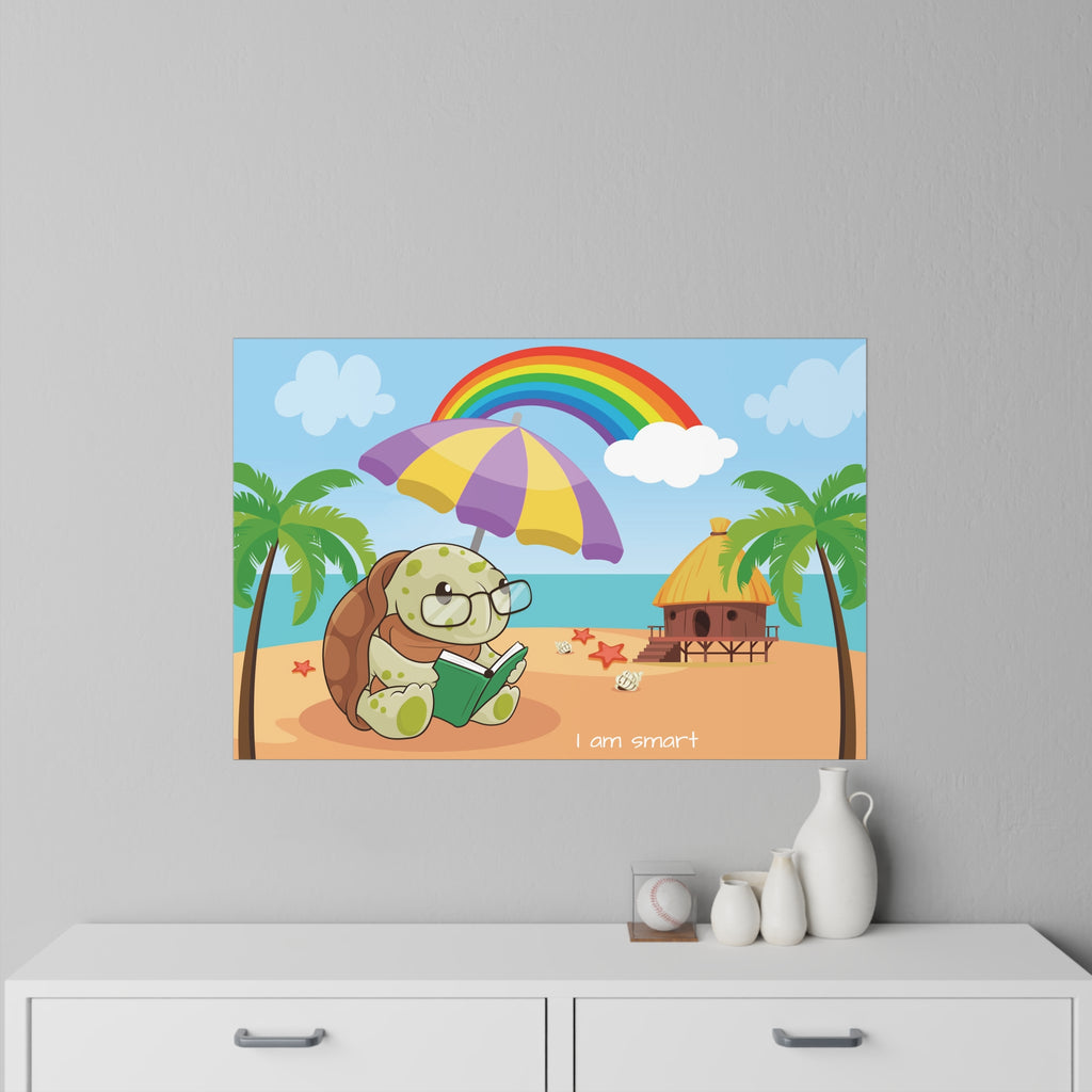 A 36 by 24 inch wall decal on a grey wall above a dresser. The wall decal has a scene of a turtle reading a book under an umbrella on the beach, a rainbow in the background, and the phrase "I am smart" along the bottom.