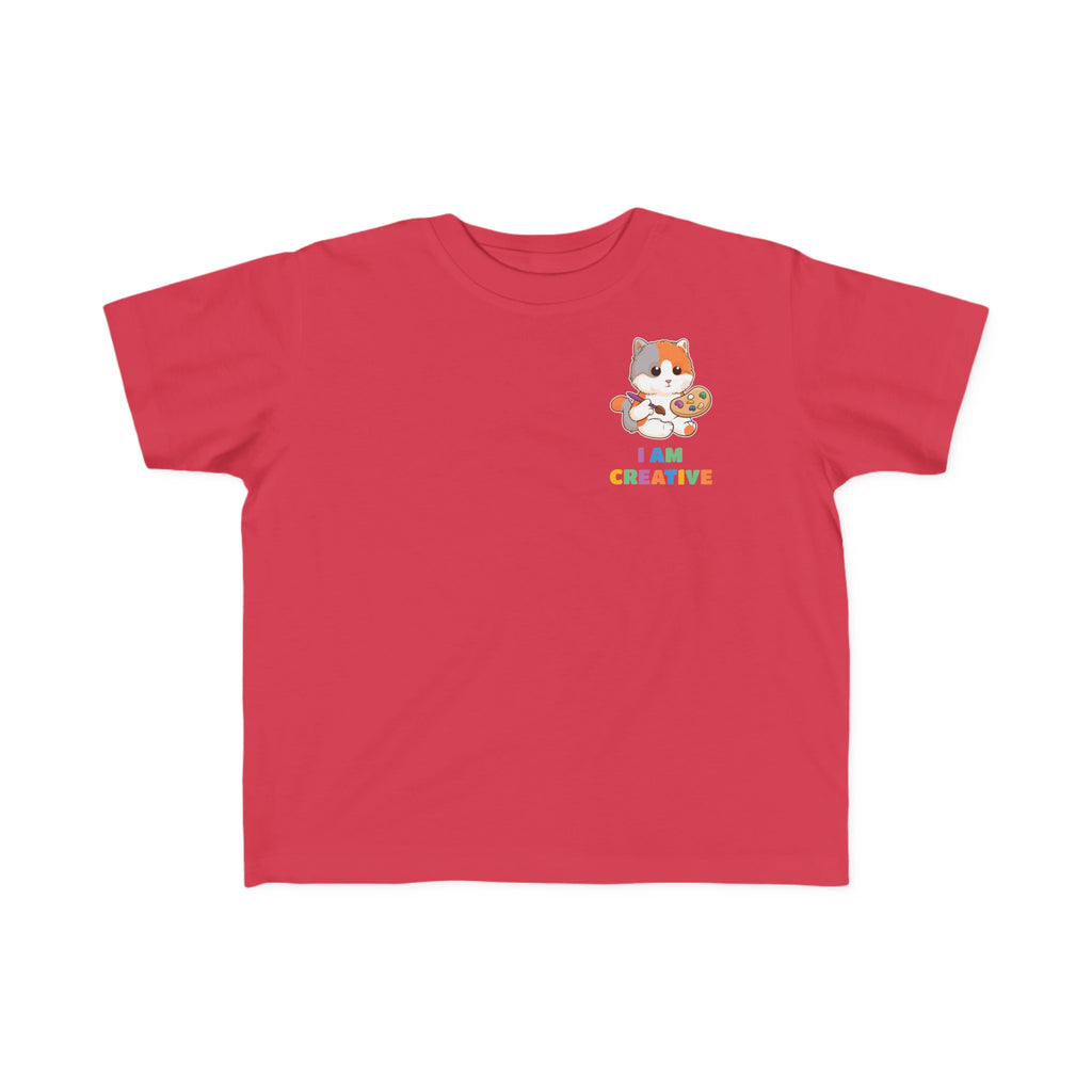 A short-sleeve red shirt with a small picture on the left chest. The image is a cat with a multi-color phrase below it that says I am creative.