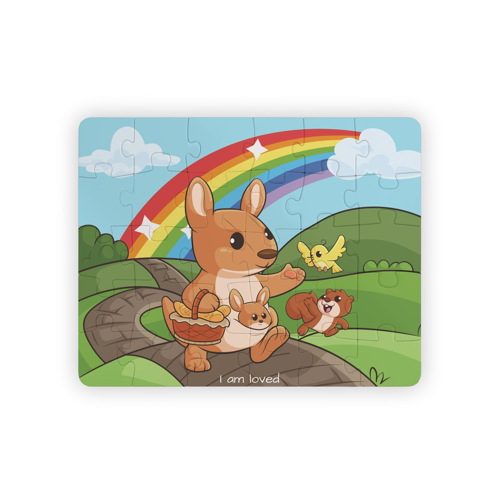 A 30 piece puzzle with a scene of a kangaroo walking on a path through rolling hills, a rainbow in the background, and the phrase "I am loved" along the bottom.