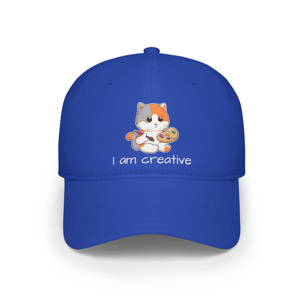 Front-view of a royal blue baseball hat with a picture of a cat that says I am creative.
