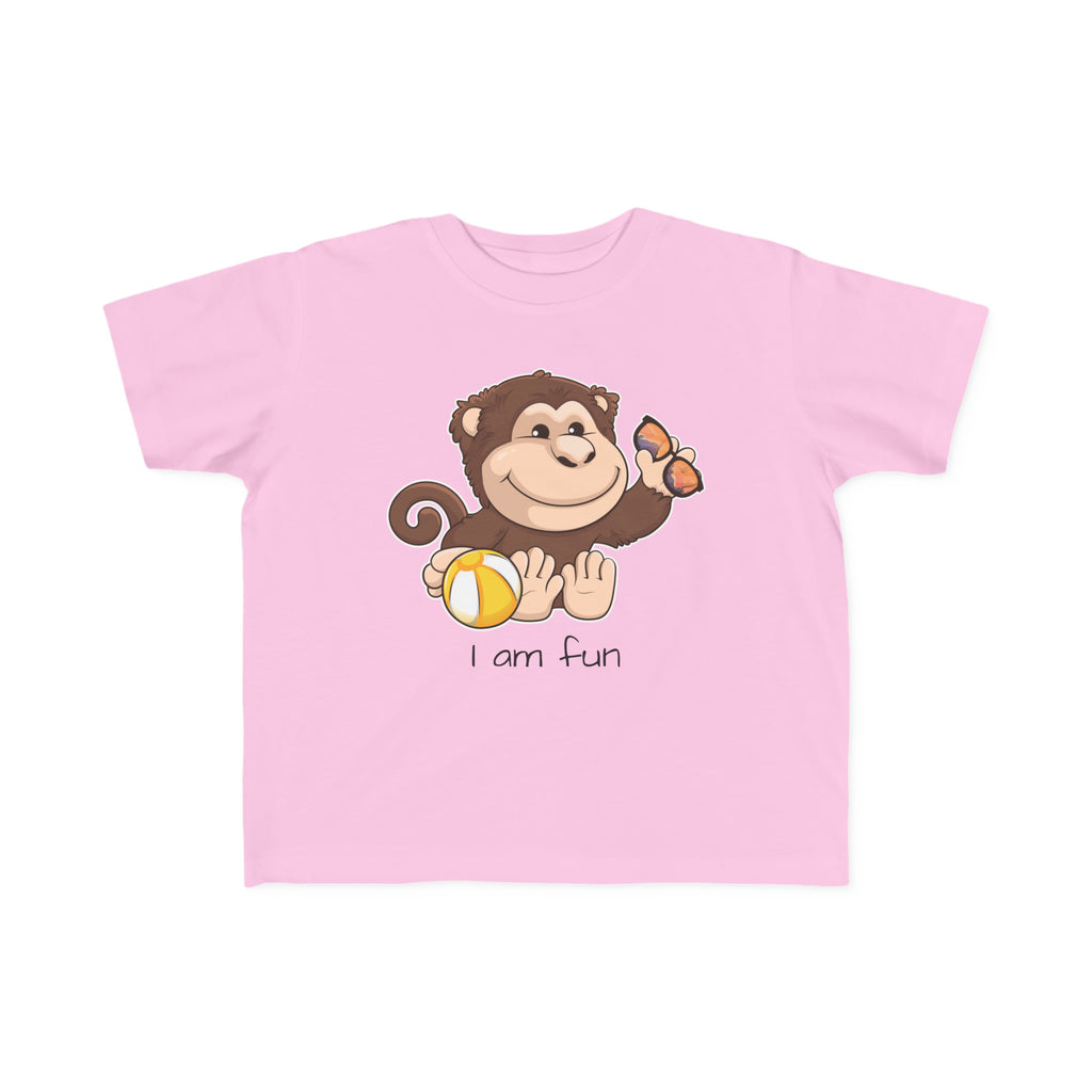 A short-sleeve light pink shirt with a picture of a monkey that says I am fun.