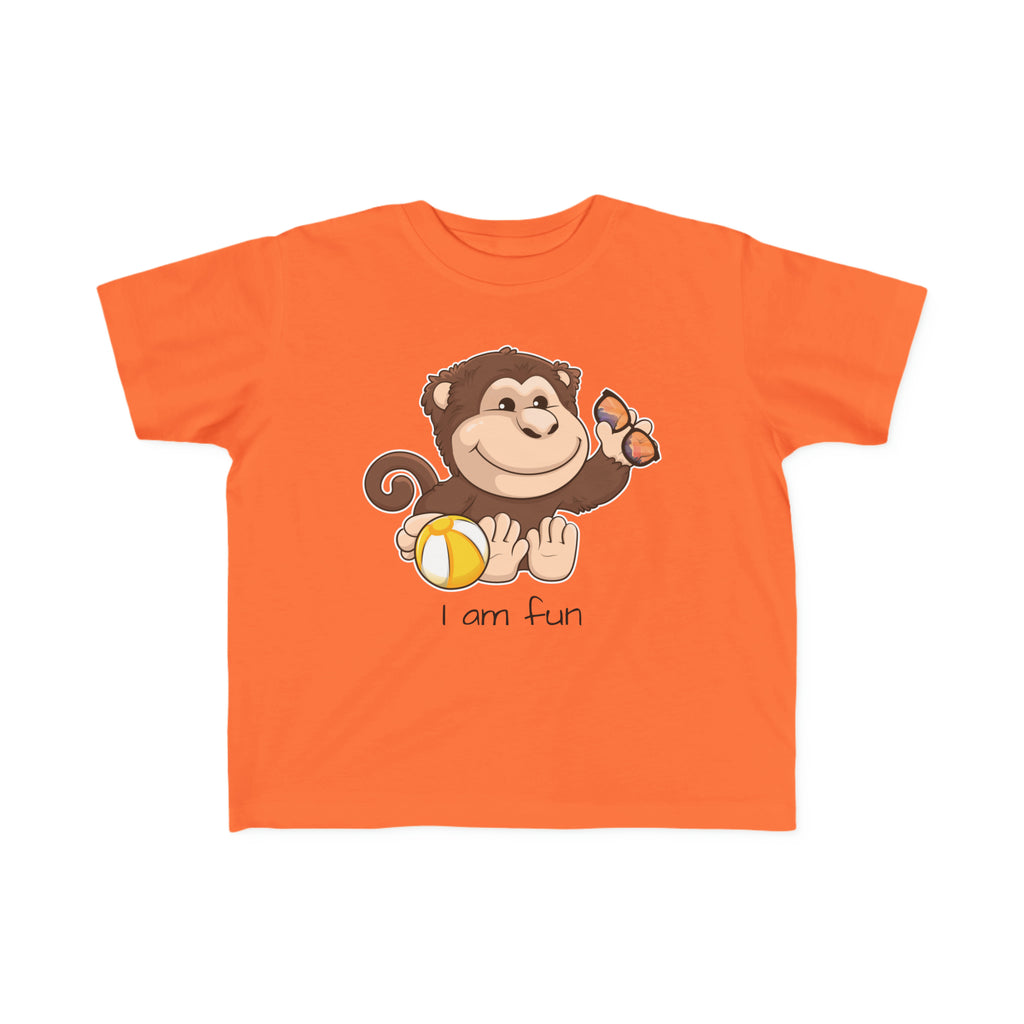 A short-sleeve orange shirt with a picture of a monkey that says I am fun.