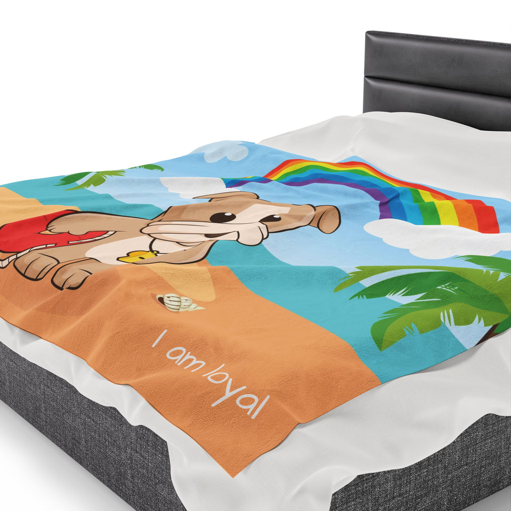 Side-view of a 60 by 80 inch blanket on a queen-sized bed. The blanket has a scene of a dog lifeguard standing on a beach with a rainbow in the background and the phrase "I am loyal" along the bottom.