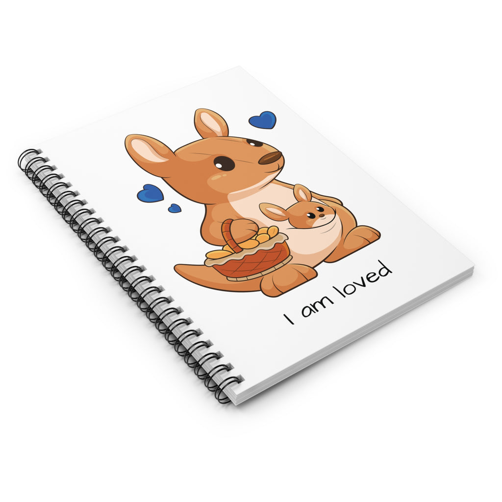 Side-view of a white spiral notebook laying closed, featuring a picture of a kangaroo that says I am loved.