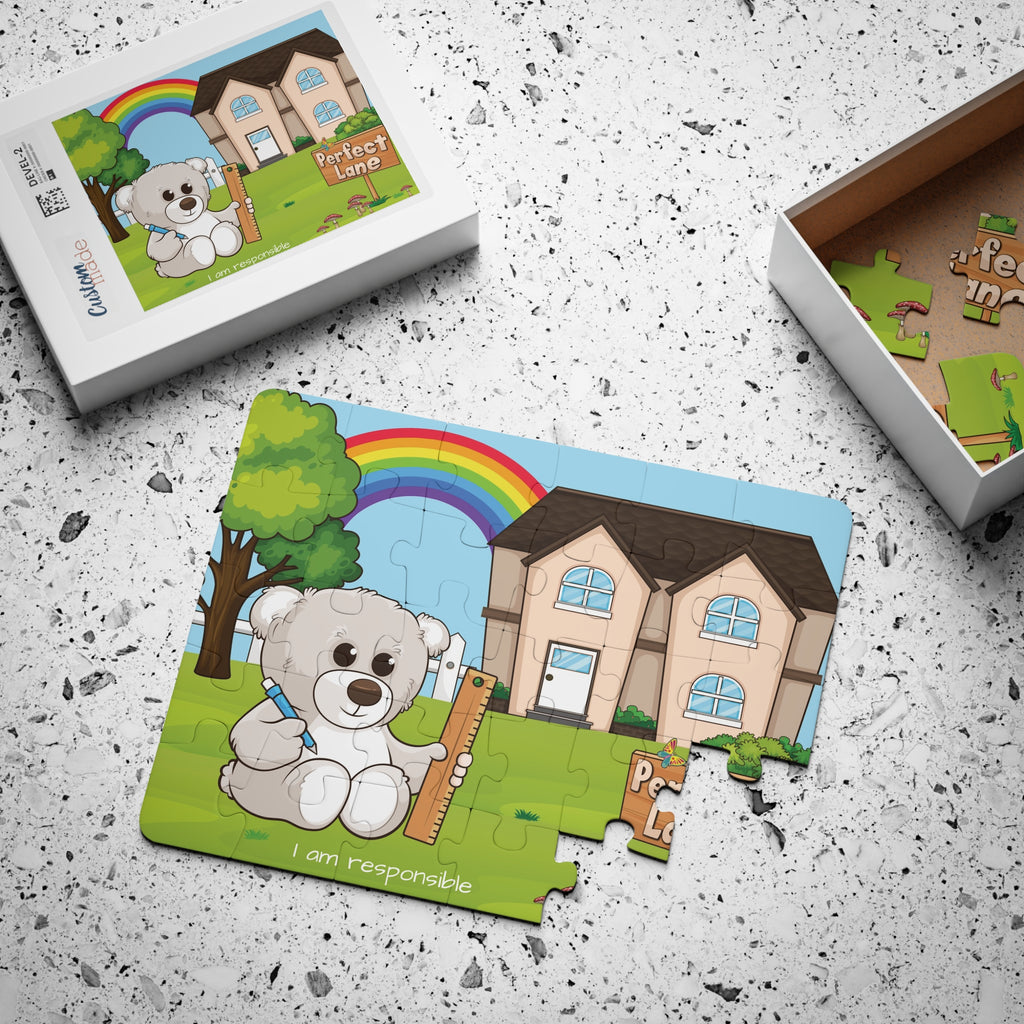A 30 piece puzzle with a scene of a bear sitting in the yard of its house, a rainbow in the background, and the phrase "I am responsible" along the bottom. The puzzle is mostly assembled next to its container box.