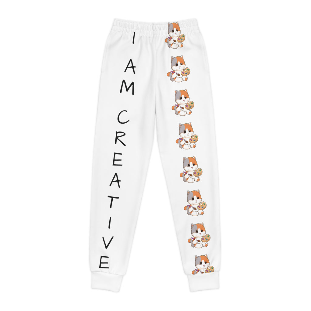 White sweatpants with a line of cats down the front left leg and the phrase "I am creative" down the front right leg.