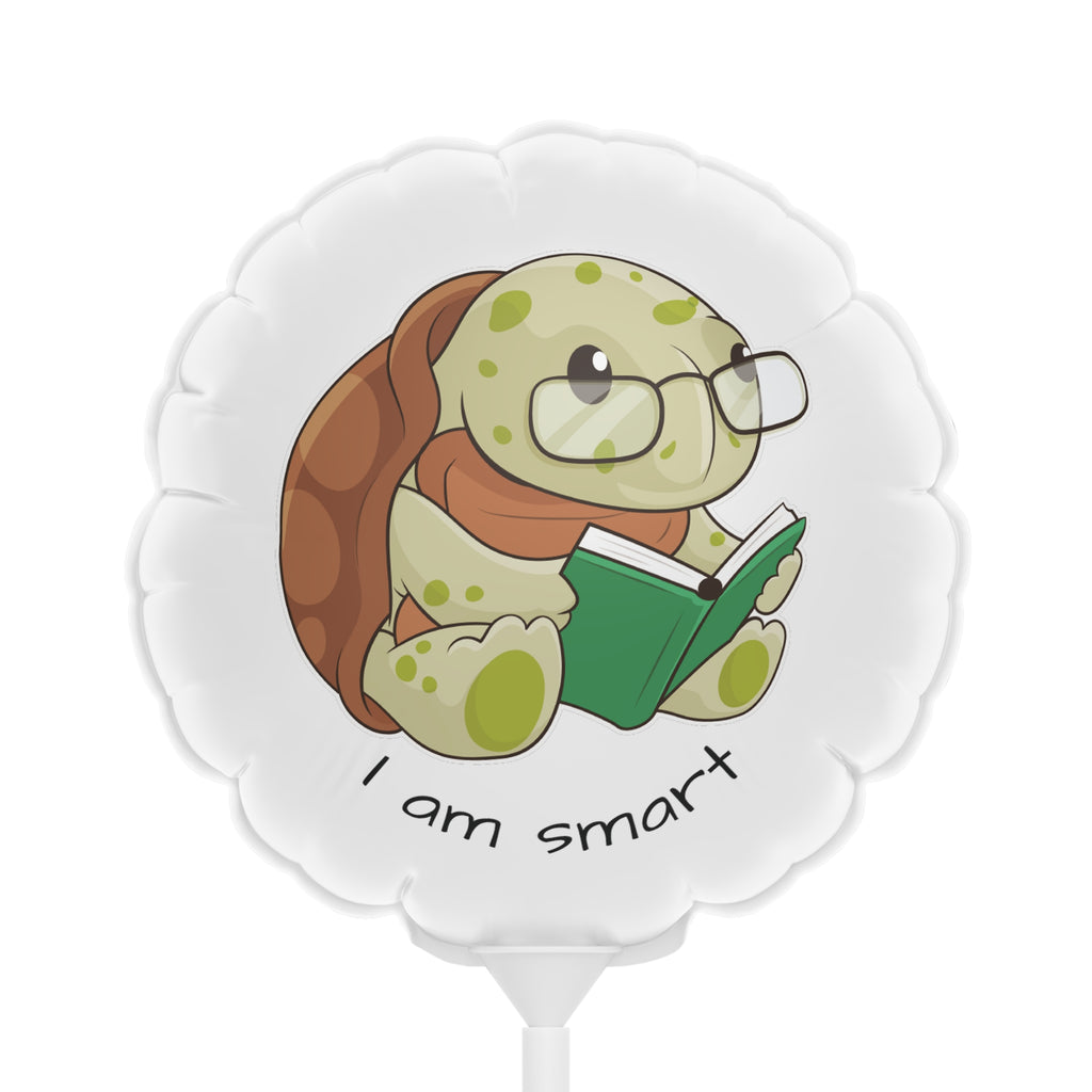 A round white mylar balloon on a stick with a picture of a turtle that says I am smart.