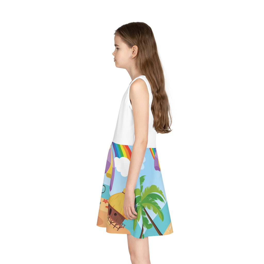 Left side-view of a girl wearing a sleeveless dress. The dress has a white top and the skirt features a scene of a turtle reading a book under an umbrella on the beach and the phrase "I am smart".