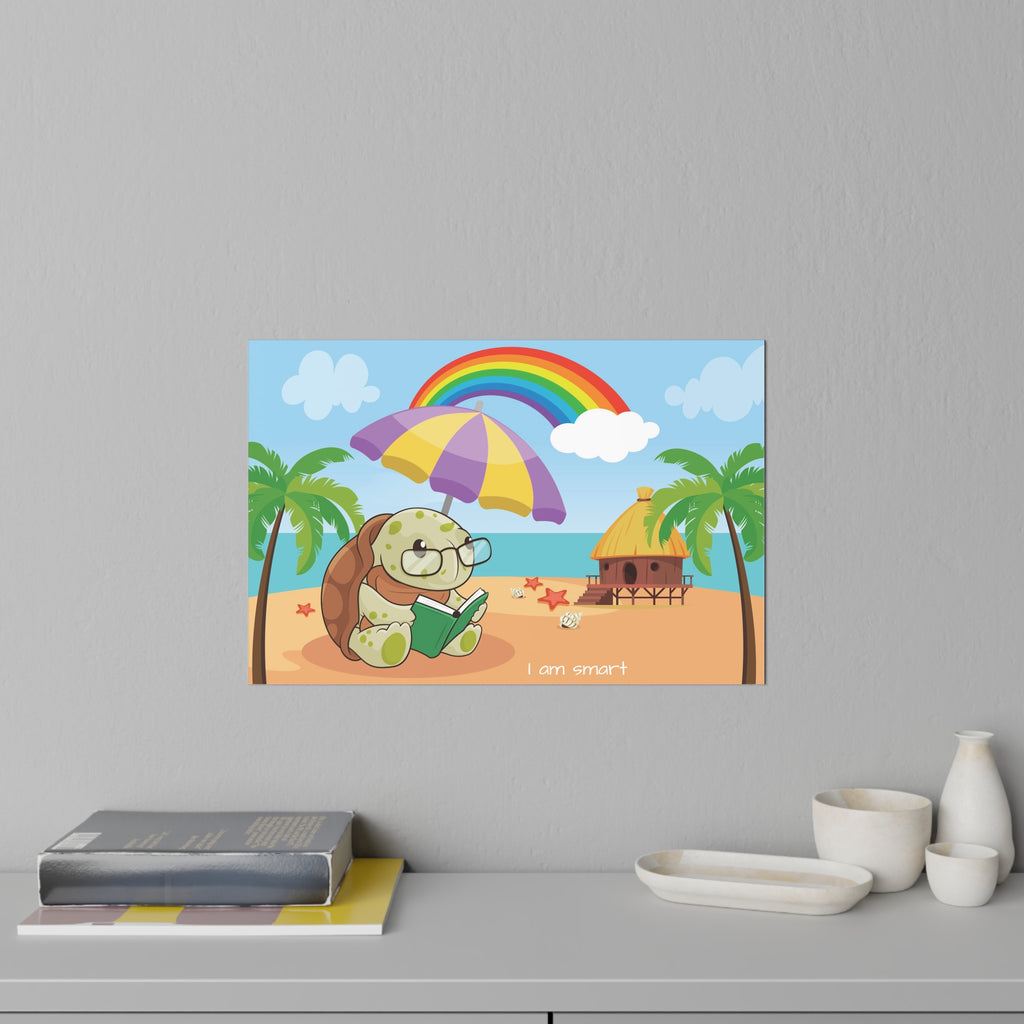 A 36 by 24 inch wall decal on a grey wall above a dresser and books. The wall decal has a scene of a turtle reading a book under an umbrella on the beach, a rainbow in the background, and the phrase "I am smart" along the bottom.