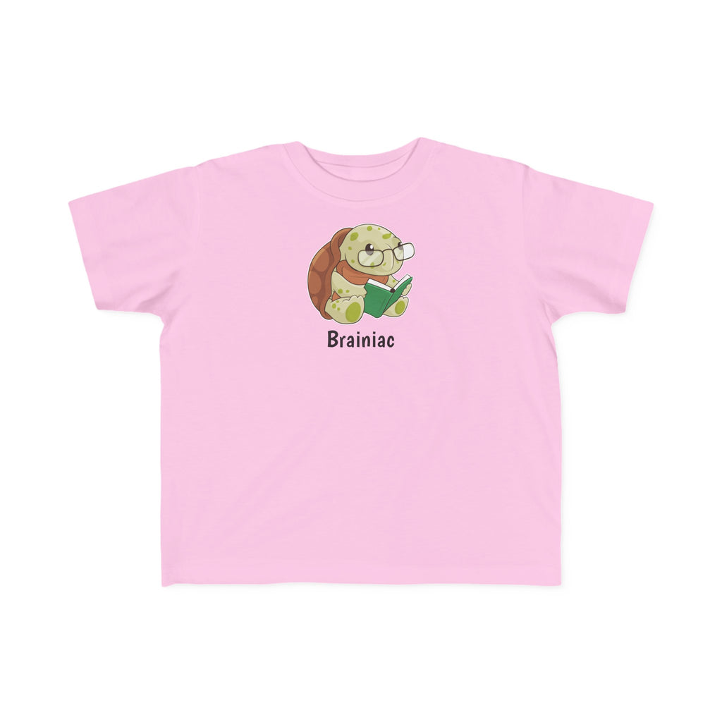 A short-sleeve light pink shirt with a picture of a turtle that says Brainiac.