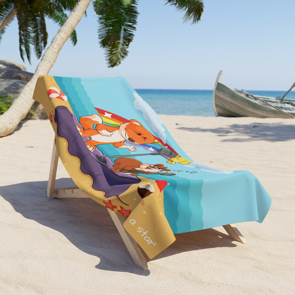 A 36 by 72 inch beach towel draped over a chair on a beach. The towel has a scene of a fox singing with a bird and squirrel on a stage on the beach, a rainbow in the background, and the phrase "I am a star" along the bottom.