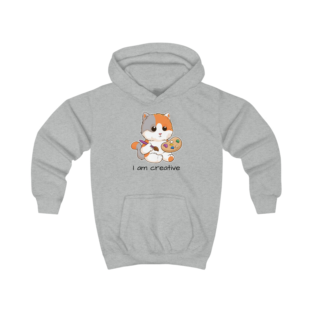 A heather grey hoodie with a picture of a cat that says I am creative.