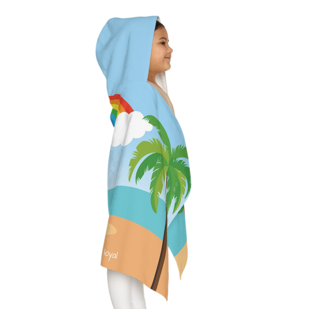 Right side-view of a girl wearing a hooded towel and holding it closed around her. The towel has a scene of a dog lifeguard standing on the beach, a rainbow in the background, and the phrase "I am loyal" along the bottom.