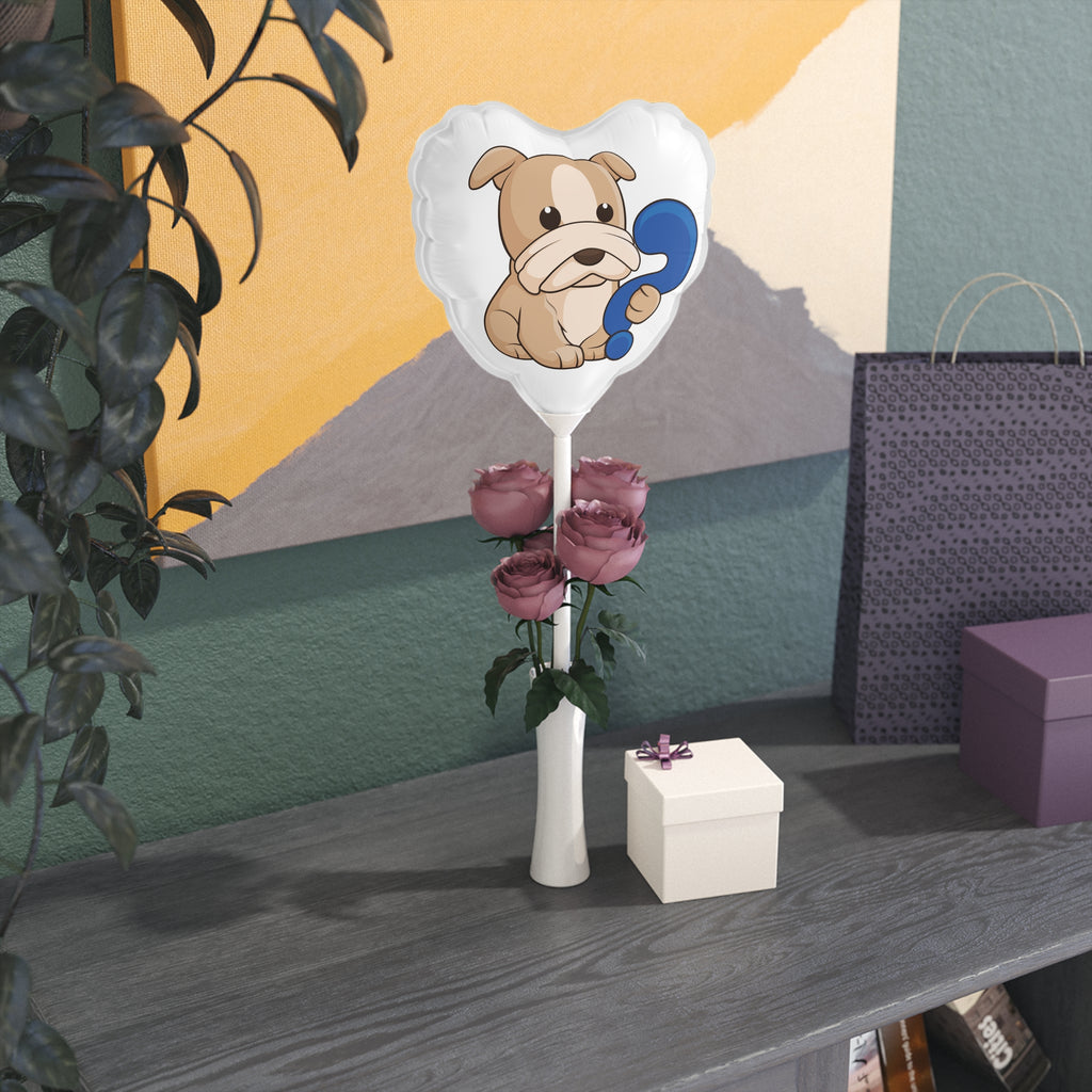 A heart-shaped white mylar balloon on a stick with a picture of a dog. The balloon sits on a table decorated for an event.