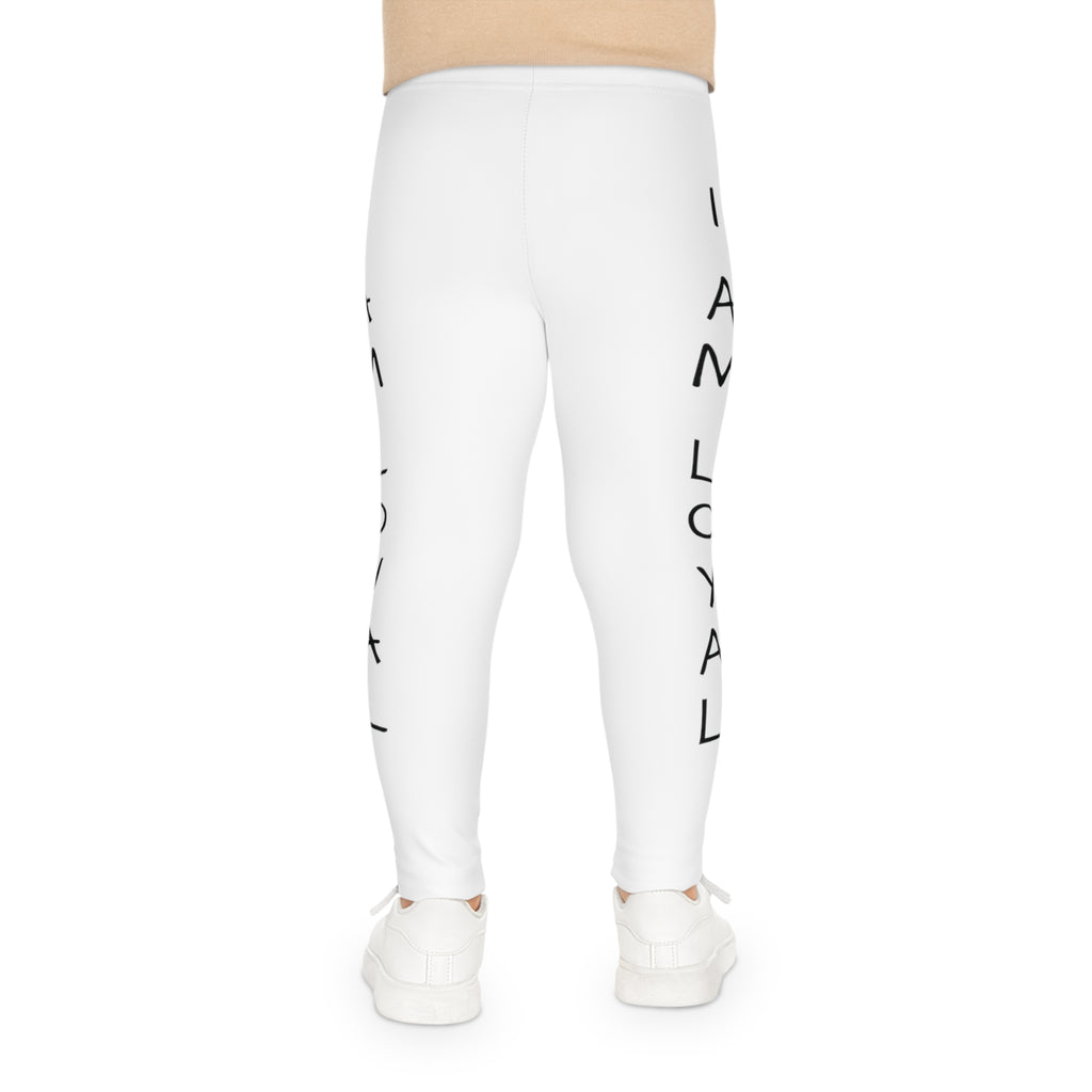 Back-view of a child wearing white leggings with the phrase "I am loyal" read top to bottom on the side of each leg.