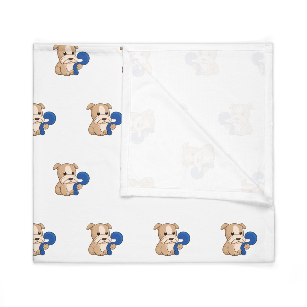 A white swaddle blanket with a repeating pattern of a dog. The blanket is folded into a square.