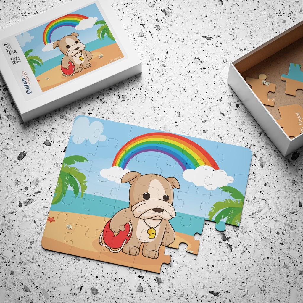 A 30 piece puzzle with a scene of a dog lifeguard standing on a beach, a rainbow in the background, and the phrase "I am loyal" along the bottom. The puzzle is mostly assembled next to its container box.
